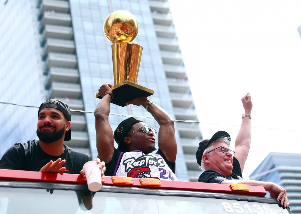 Drake and Kyle Lowry #7 of the Toronto Raptors holds the championship trophy during the Toronto Raptors Victory Parade on June 17, 2019 in Toronto, Canada. The Toronto Raptors beat the Golden State Warriors 4-2 to win the 2019 NBA Finals. 